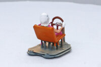 3D printed female driver figure wearing a headscarf type...